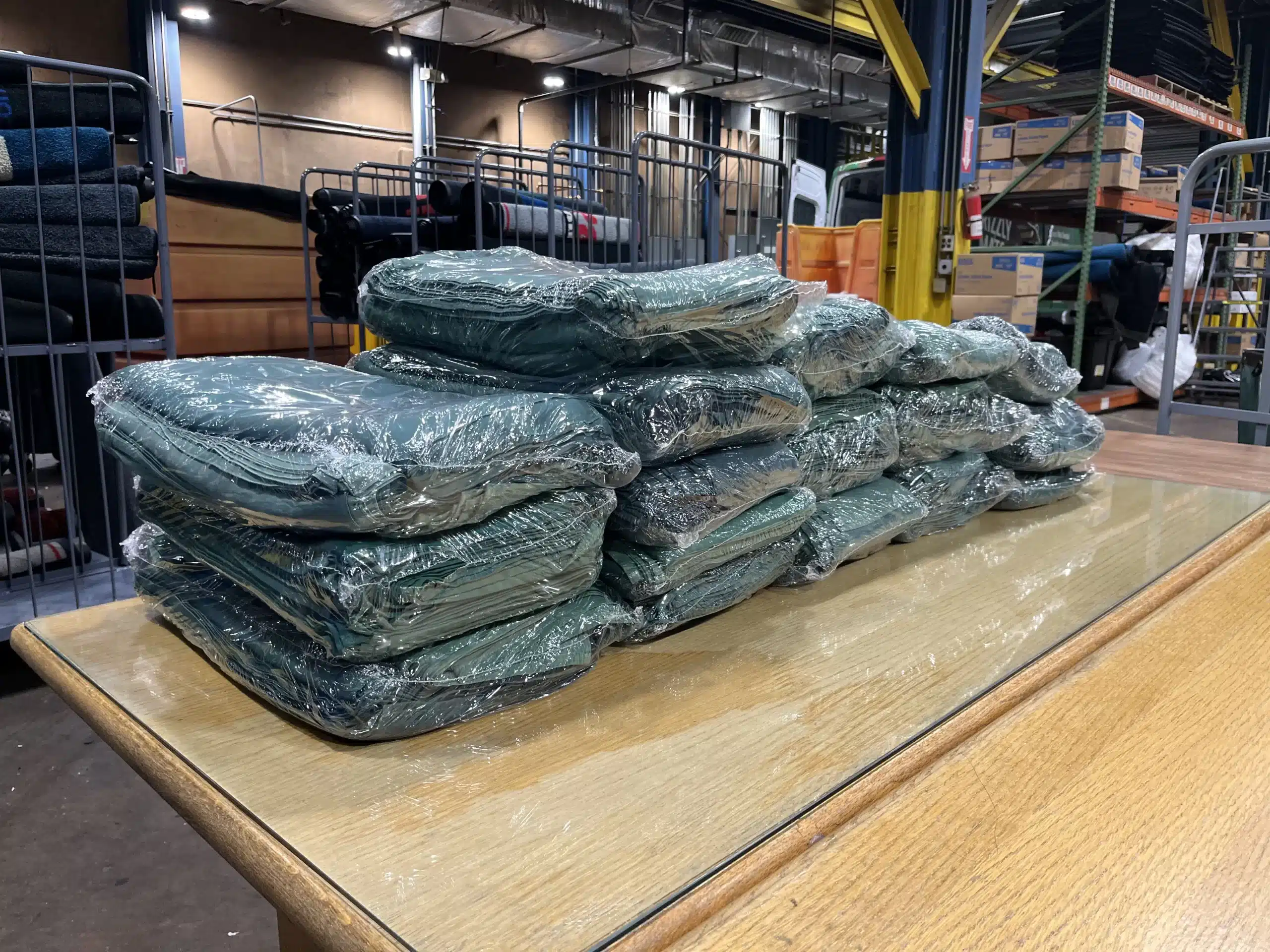 Fresh Commercial Linens Folded On A Wood Table Scaled Fresh Commercial Linens Folded on a Wood Table